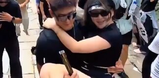Woman being carried by a man during Mount Tai climb