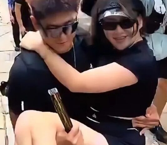 Woman being carried by a man during Mount Tai climb