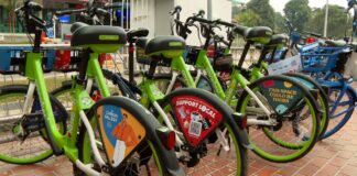Shared bicycles parked outside a designated parking area in Singapore