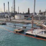 Shell Singapore Charged Over 2 Pulau Bukom Oil Leaks, Including About 40 Tonnes of Oily Mixture Containment booms deployed at Pulau Bukom after Shell oil leak (MPA/NEA joint photo via CNA host)