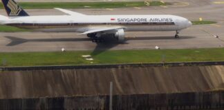 Singapore Airlines Boeing 777 in standard blue and gold livery taxiing at Changi Airport