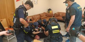 Taiwan Aviation Police subduing suspect at Taoyuan Airport