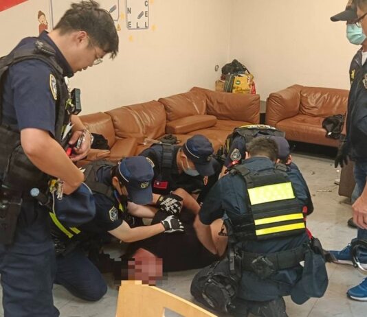 Taiwan Aviation Police subduing suspect at Taoyuan Airport