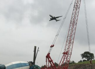 Worker, 22, Dies After Falling From 12th Storey at Tanjong Rhu BTO Construction Site Construction site with cranes in Singapore, illustrative of worksite safety