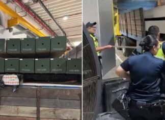 ICA officers inspecting lorry with concrete piles where duty-unpaid cigarettes were concealed at Tuas