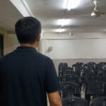 Indoor community hall representing a welfare home setting