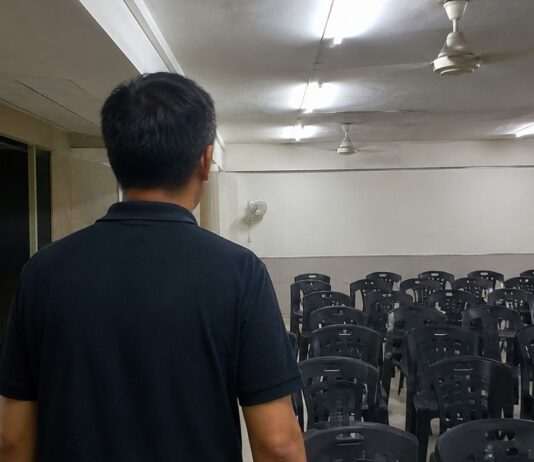 Indoor community hall representing a welfare home setting