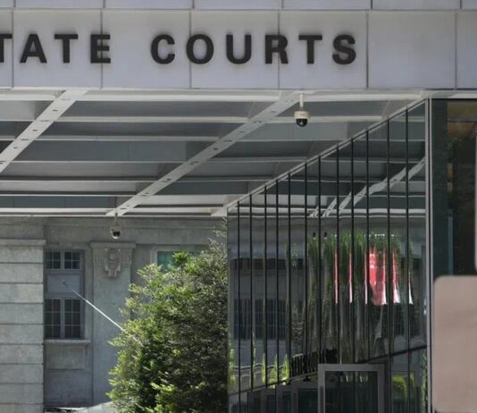Woman, 62, Charged Over Alleged Participation in 6 Public Assemblies Without Permit State Courts entrance exterior (Zaobao OG) — non-literal venue; not an incident photo of Ng Chye Huay