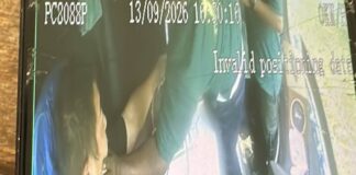 CCTV still of worker grabbing chartered bus driver Cai Zhi Feng by the face during workers brawl