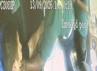 CCTV still of worker grabbing chartered bus driver Cai Zhi Feng by the face during workers brawl