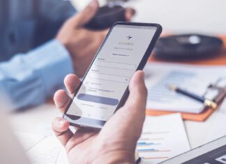 About 110,000 Alliance Medinet Members’ Personal Data Compromised in Cyber Incident Person holding a smartphone showing a healthcare app login screen