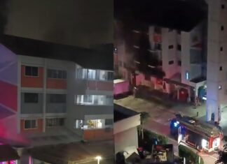 Fire at Bukit Batok West Avenue 4 coffee shop block at night, with fire engine below (Image: Threads, TikTok via 8world)