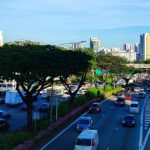 Illustrative photo of weekday traffic on the Pan Island Expressway in Singapore, with HDB and condo blocks in the background; number plates blurred (Photo: ZKang123 / Wikimedia Commons, CC BY-SA 4.0)