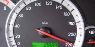 Illustrative photo of a car speedometer needle at about 220km/h