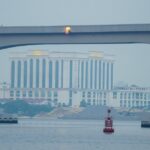 Johor Bahru waterfront seen from Woodlands through the RTS viaduct during the 2026 haze