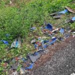 Broken motorcycle parts and scattered oil palm fruit on the roadside at the crash site on Jalan Parit Haji Sirat in Pontian, Johor, on 8 Oct 2026 (Photo: Sinar Harian)