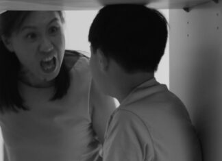 Black-and-white scene of an angry woman shouting at a child