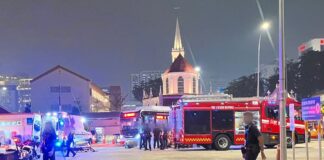 SCDF and police vehicles and officers at Queen Street Bus Terminal on the night of 6 October 2026