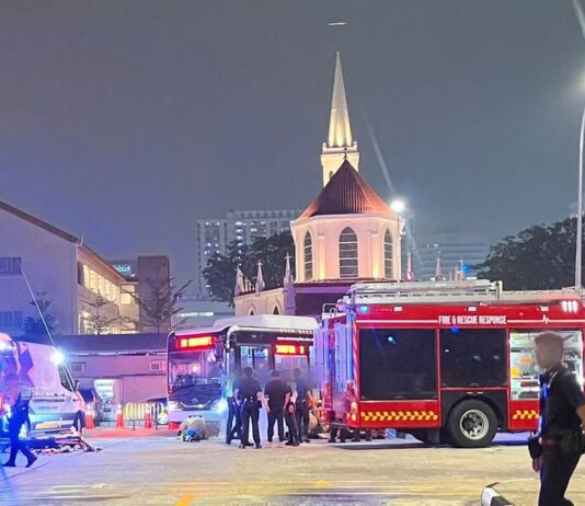 SCDF and police vehicles and officers at Queen Street Bus Terminal on the night of 6 October 2026