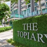 Wall and Bush May Have Blocked View of Girl, 7, Killed by School Bus: Coroner The entrance sign of The Topiary condominium in Sengkang, set on a green hedge wall in front of the condo blocks (Photo: Qingjian International via 8world)