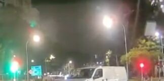 Dashcam still of white van near Compassvale Street junction after hitting a traffic-light pole
