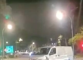 Dashcam still of white van near Compassvale Street junction after hitting a traffic-light pole