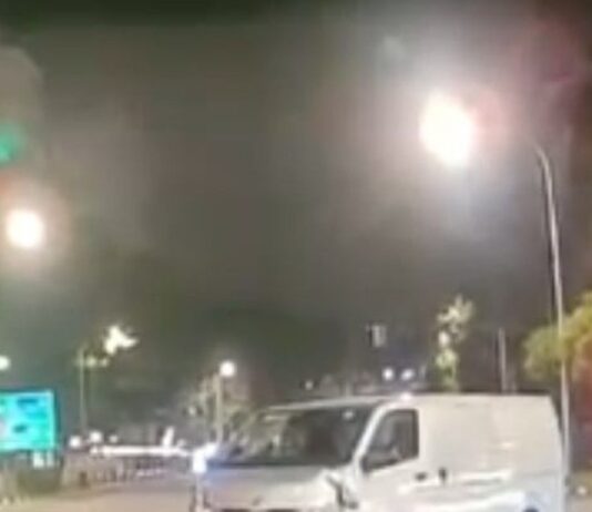 Van Nearly Hits Pedestrian in Sengkang, Smashes Traffic Light Pole and Drives Off Dashcam still of white van near Compassvale Street junction after hitting a traffic-light pole