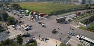 Aerial view of the Tampines Avenue 1 and Avenue 4 junction after the April 2024 chain collision, with an overturned car in the middle of the road