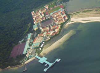 NSF Dies After Being Found Unconscious at Foot of Pulau Tekong Building File aerial view of the Basic Military Training Centre camp on Pulau Tekong, with its jetty and the surrounding forest and sea, taken in 2008 (Photo: Tunafish1990 / Wikimedia Commons, CC BY-SA 3.0)
