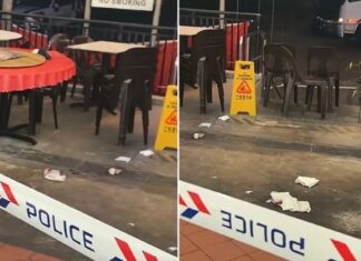 73-Year-Old Man Dies, Another Injured in Telok Blangah Heights Incident; 32-Year-Old Man Arrested Police tape cordoning off the ground-floor coffee shop near Block 61 Telok Blangah Heights, with empty tables and tissues on the floor (Photo: TikTok/itsmarvin via Lianhe Zaobao)