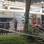 Telok Blangah Suspect Charged With Murder, Remanded for Psychiatric Assessment Police cordon tape outside a coffee shop at Telok Blangah Heights on the night of 5 Oct 2026, with police officers standing inside the cordoned-off area (Photo: Shin Min Daily News via Lianhe Zaobao)