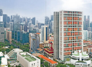 Aerial view of Singapore's State Courts building among city skyscrapers