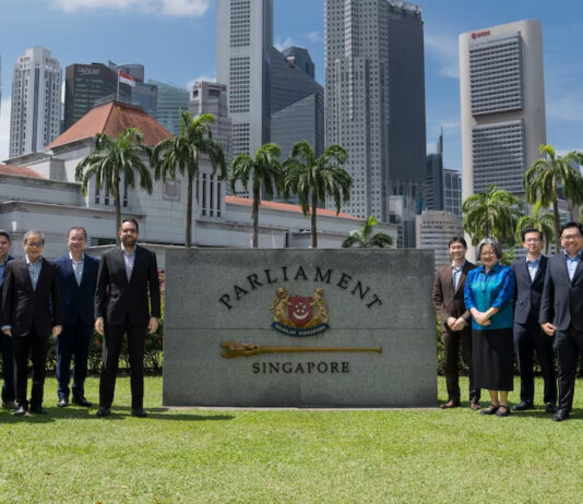 WP Backs Call to Honour Gas Contracts After Indonesia Cuts Exports to Singapore Workers' Party MPs and members posing in front of the Parliament of Singapore sign